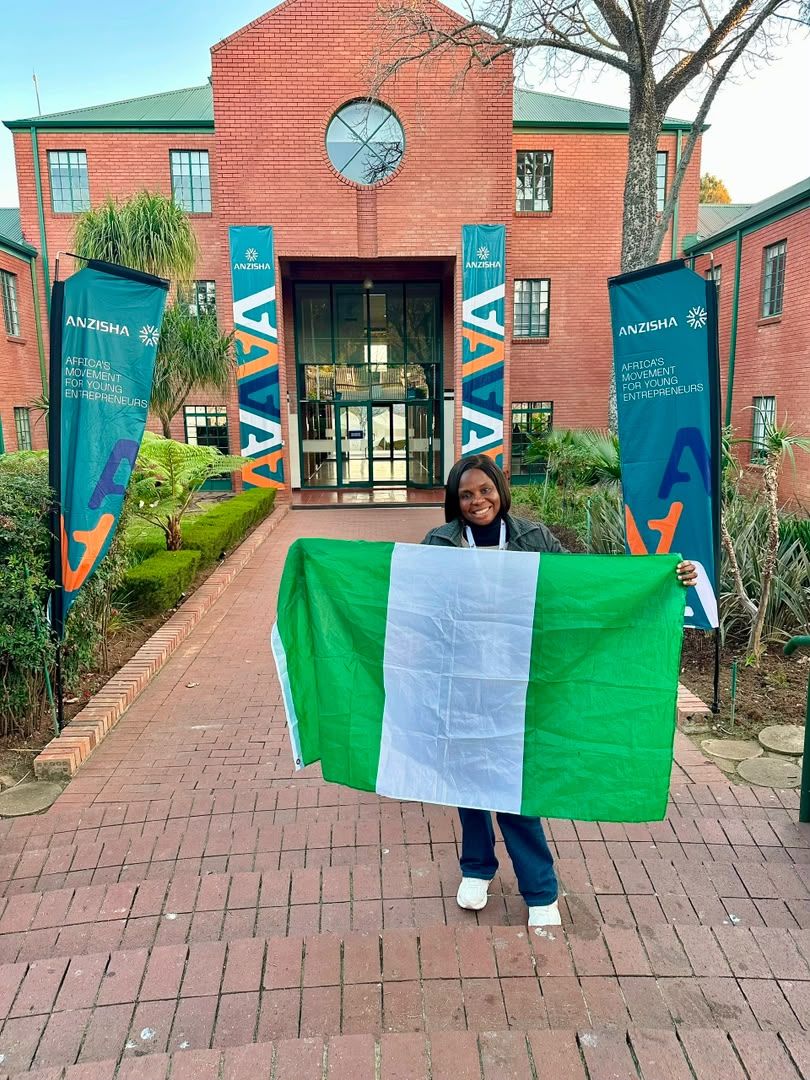 Adedolapo Osuntuyi holding the Nigerian flag at the African Leadership Academy