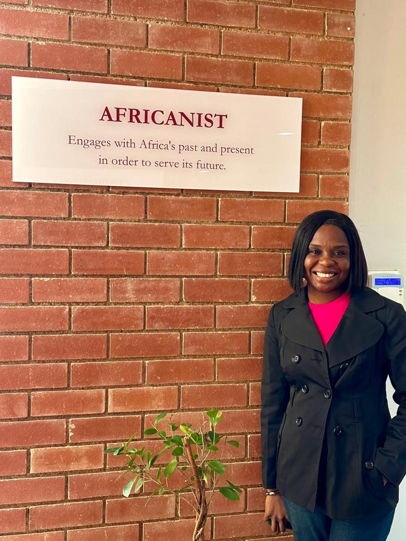 Adedolapo Osuntuyi beside the Africanist definition at the African Leadership Festival, Johannesburg