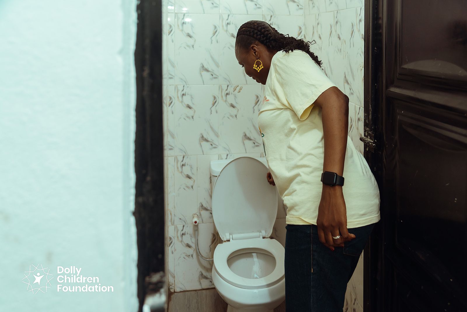 Adedolapo Osuntuyi inspecting the new toilet facility at Ebenezer Grammar School