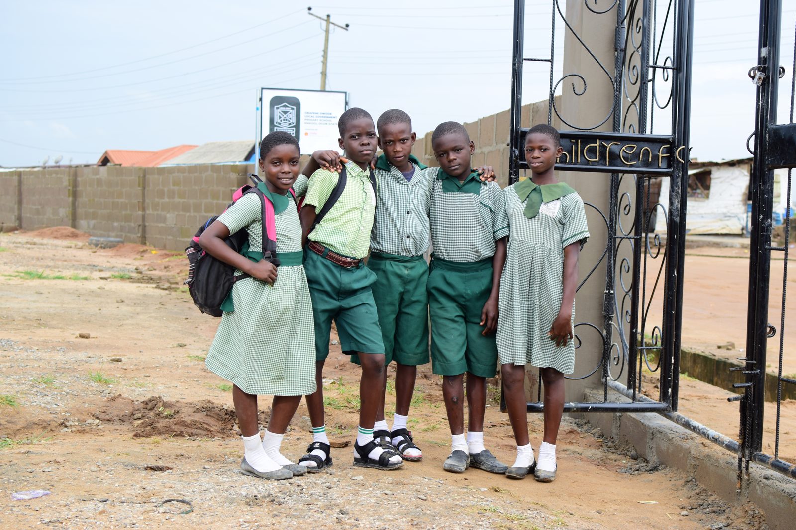 Pupils at the new school fence and gate